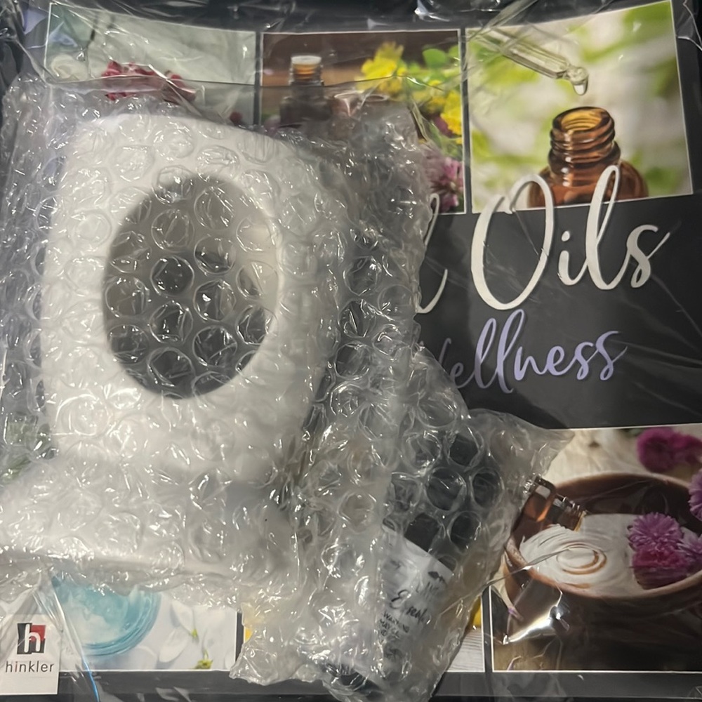 Essential oil book, oil burner and  lavender oil